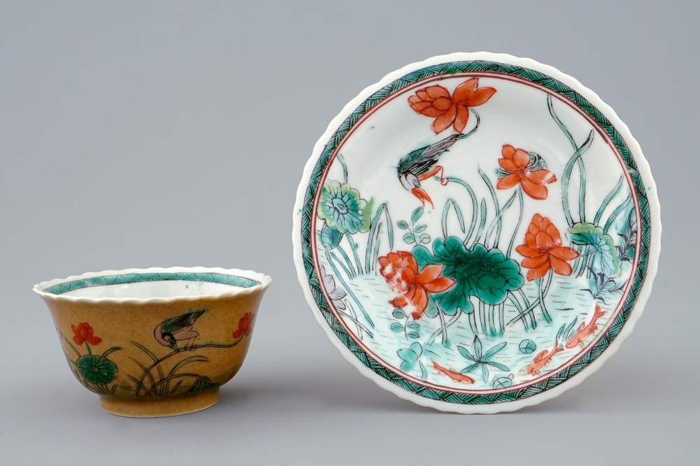 A Chinese famille verte and caf&eacute; au lait cup and saucer, Kangxi